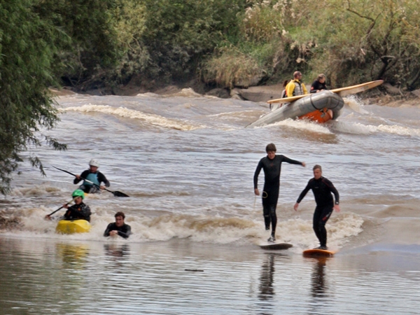 Surfers on the Severn Bore near Over Bridge