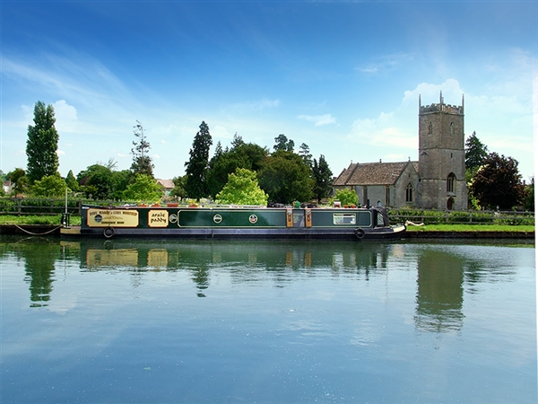 The Church of St Mary the Virgin beside the Gloucester & Sharpness Canal is a beautiful sight—enjoy the peaceful views and watch for swans and wildlife as you stroll along the towpath