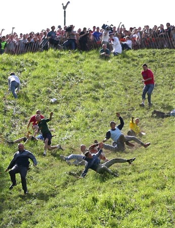 Cheese Rolling at Cooper’s Hill sends racers tumbling down steep slope